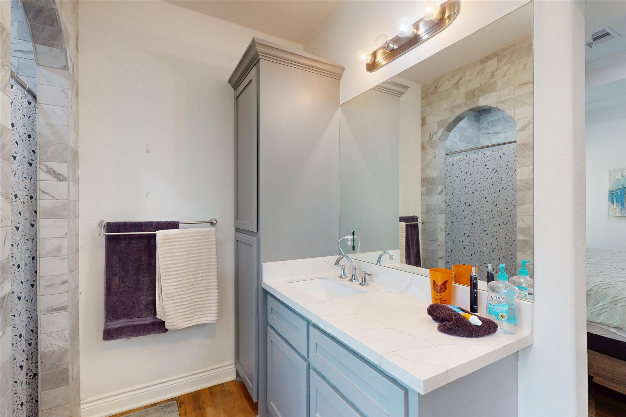7815 Timber Switch Road Cleveland, TX 77328 - Photo 32 of 40 a bathroom with a sink and mirror