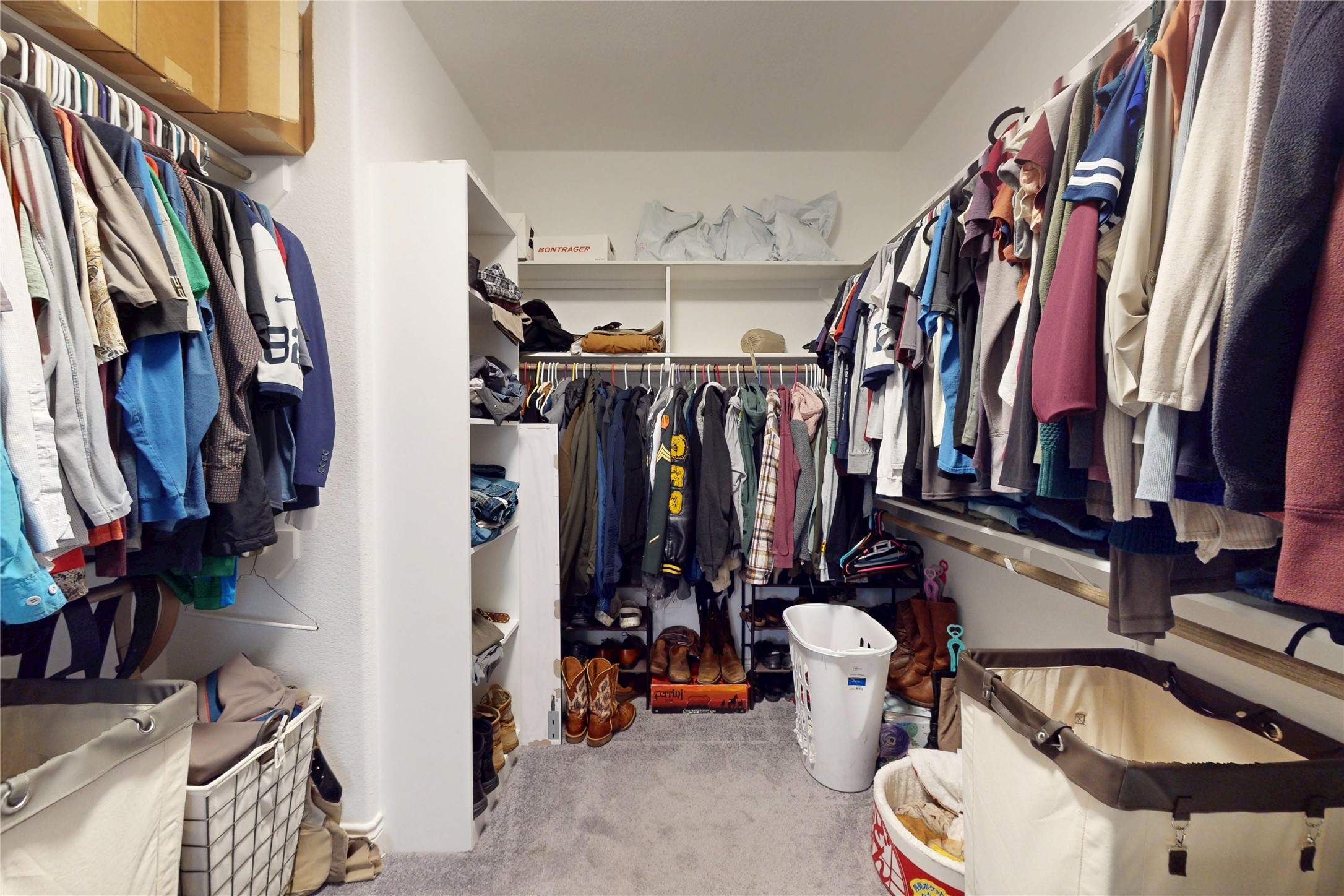7815 Timber Switch Road Cleveland, TX 77328 - Photo 34 of 40 a view of walk in closet with clothes and shoes