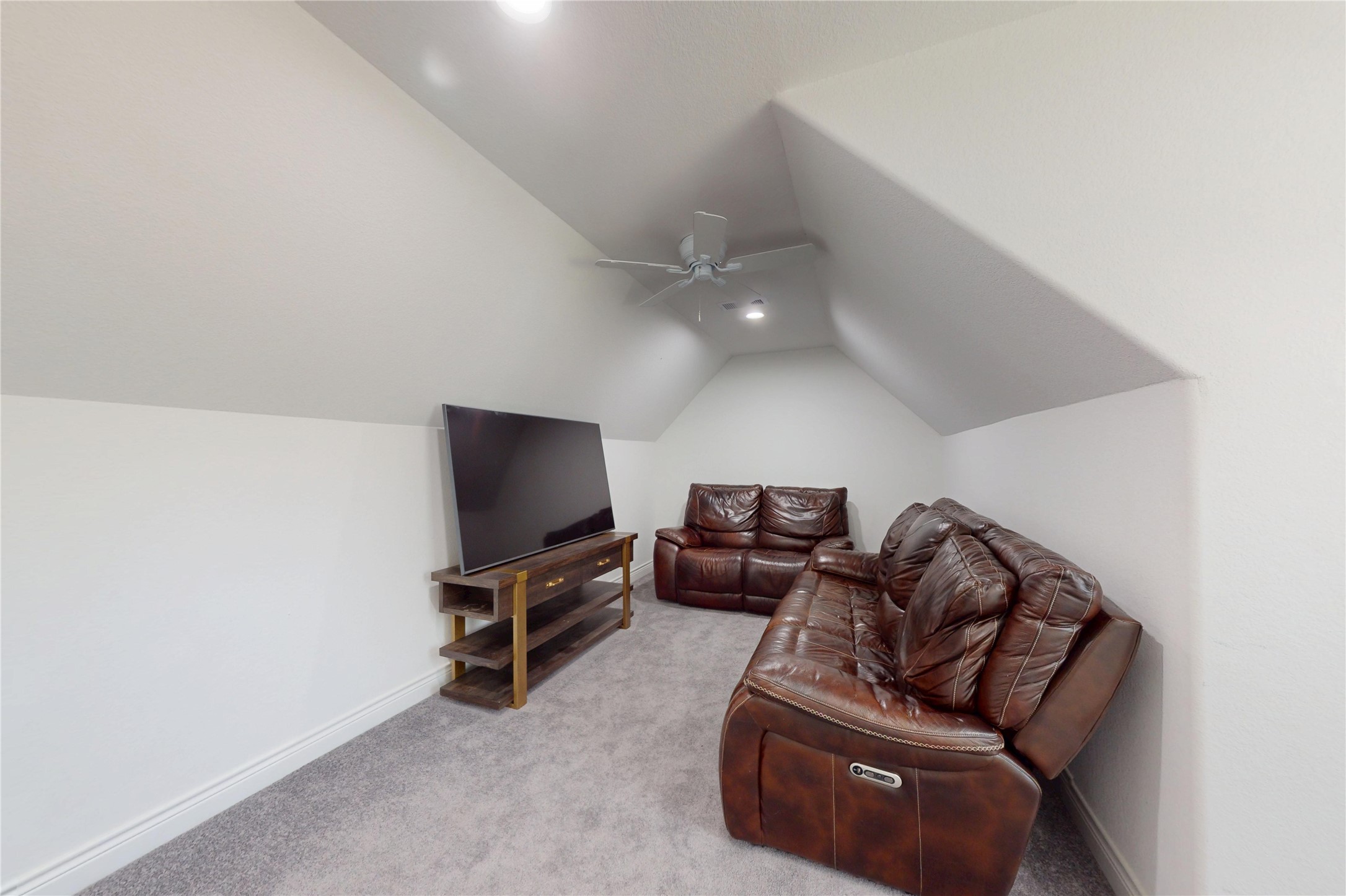 7815 Timber Switch Road Cleveland, TX 77328 - Photo 36 of 40 a living room with furniture and a flat screen tv