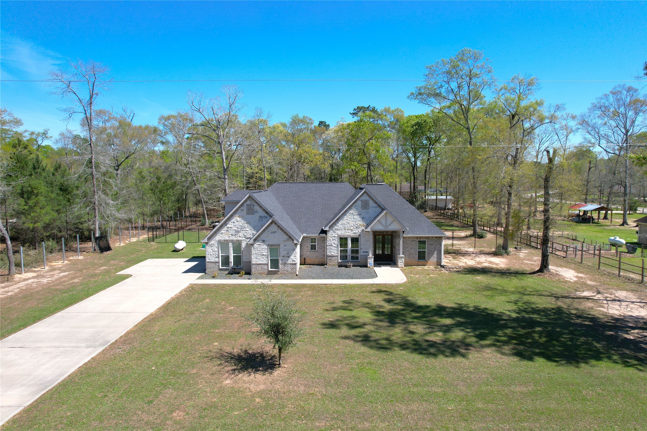 7815 Timber Switch Road Cleveland, TX 77328 - Photo 4 of 40 a view of a house with a yard and sitting area