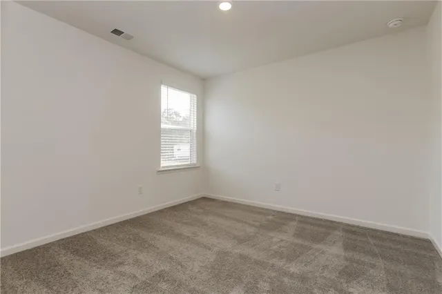 an empty room with closet area