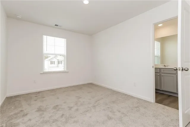 an empty room with a empty space and window