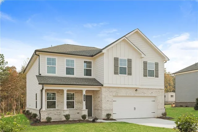 a front view of a house with a yard