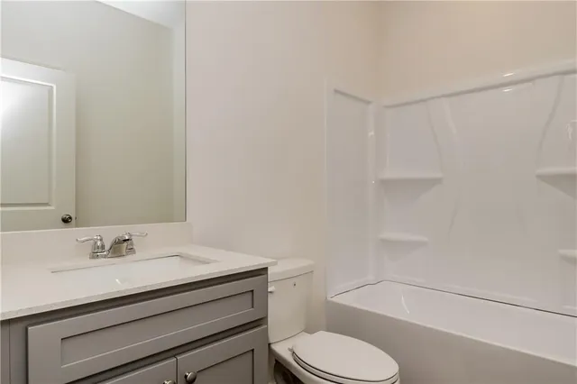 a view of bathroom with a sink and a toilet