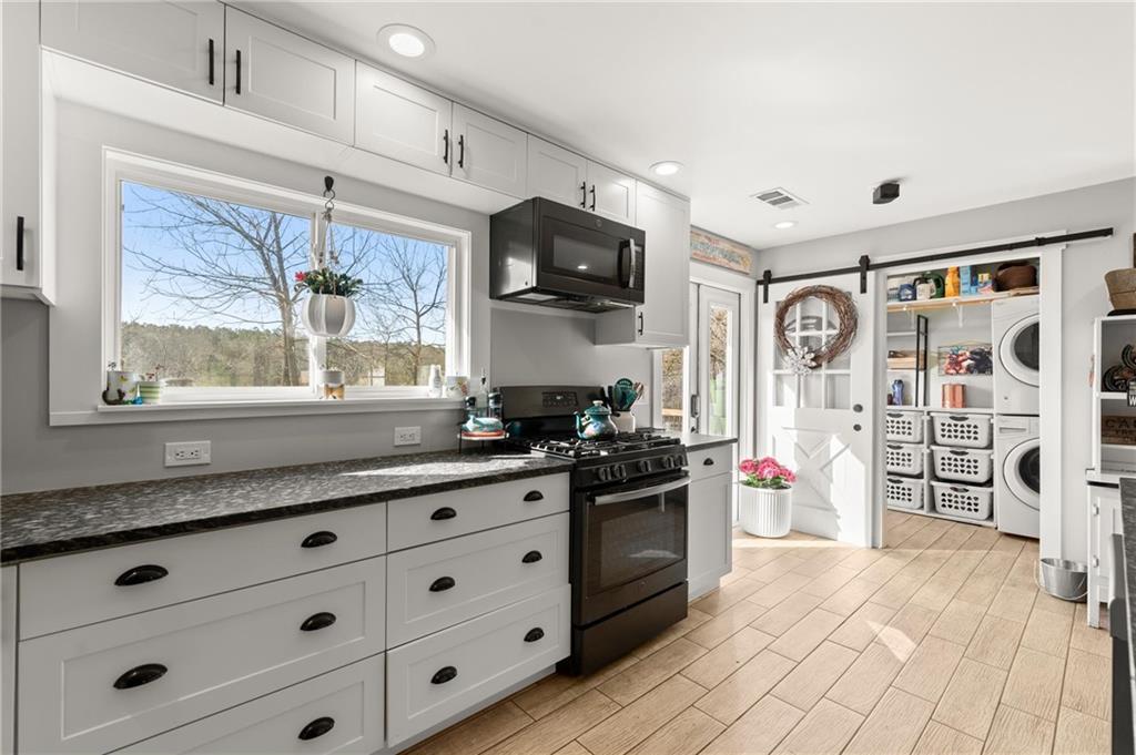 38 Hightower Road Talking Rock, GA 30175 - Photo 12 of 48 a kitchen with stainless steel appliances a stove sink and refrigerator