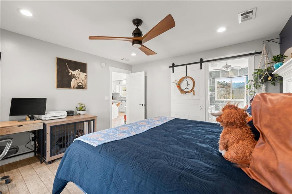38 Hightower Road Talking Rock, GA 30175 - Photo 24 of 48 a bed room with a bed and a ceiling fan