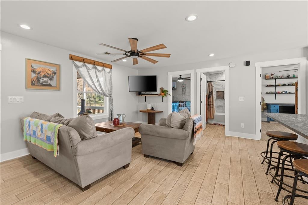 38 Hightower Road Talking Rock, GA 30175 - Photo 8 of 48 a living room with furniture and a flat screen tv