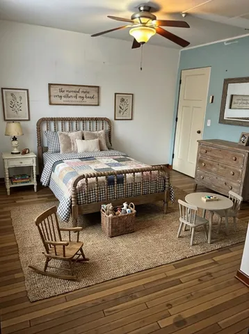 a bedroom with a bed and a table