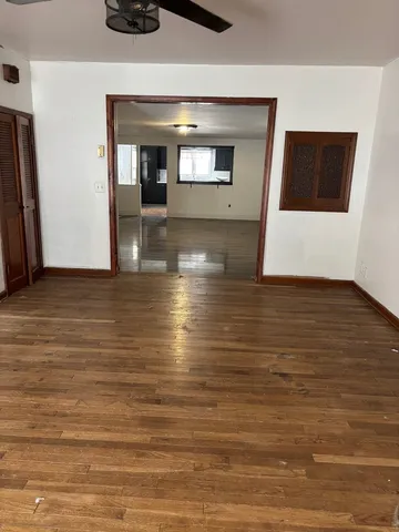 a view of a hallway with an empty room