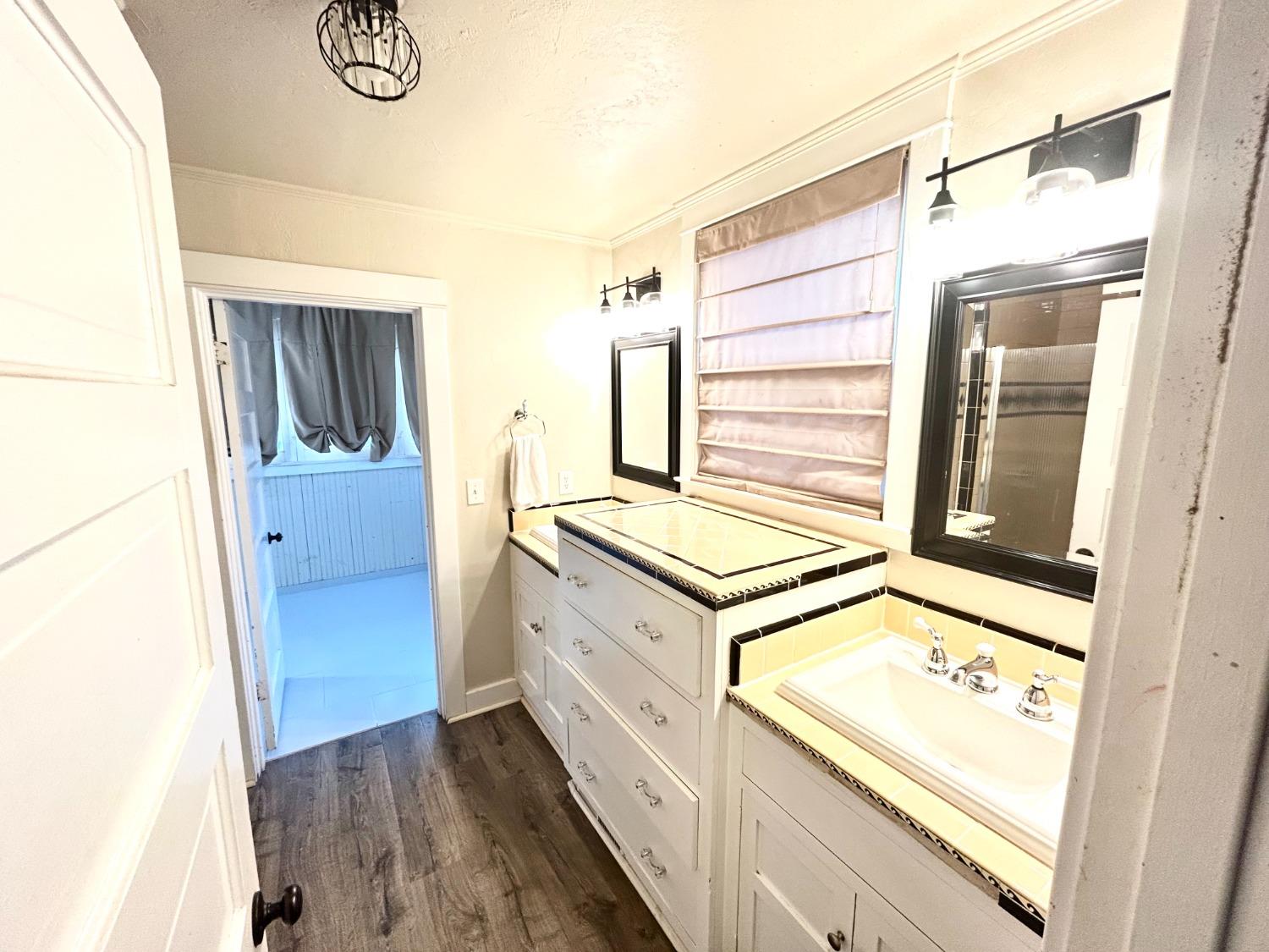 859 F Street Reedley, CA 93654 - Photo 13 of 28 a kitchen with a refrigerator and a stove