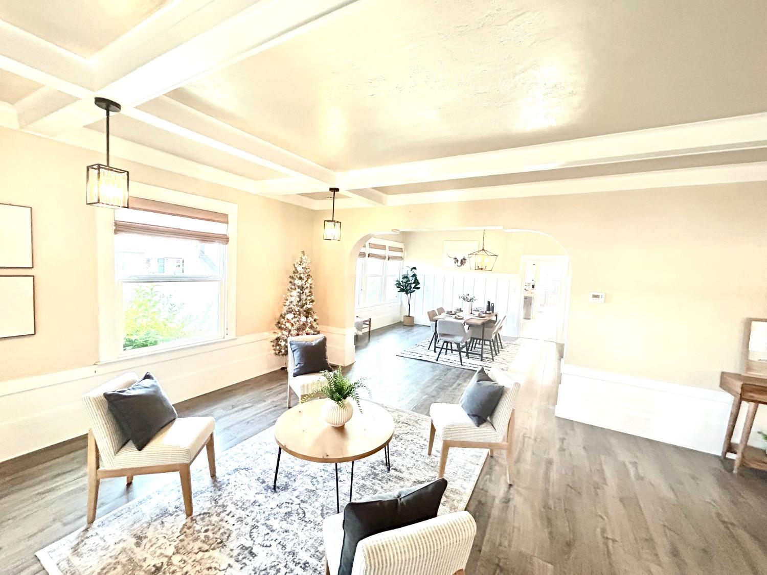 859 F Street Reedley, CA 93654 - Photo 5 of 28 a living room with furniture and a large window