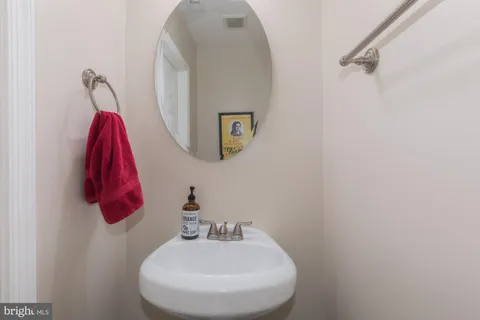 a bedroom with a bed and a chair