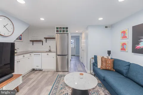 a living room with furniture and a rug