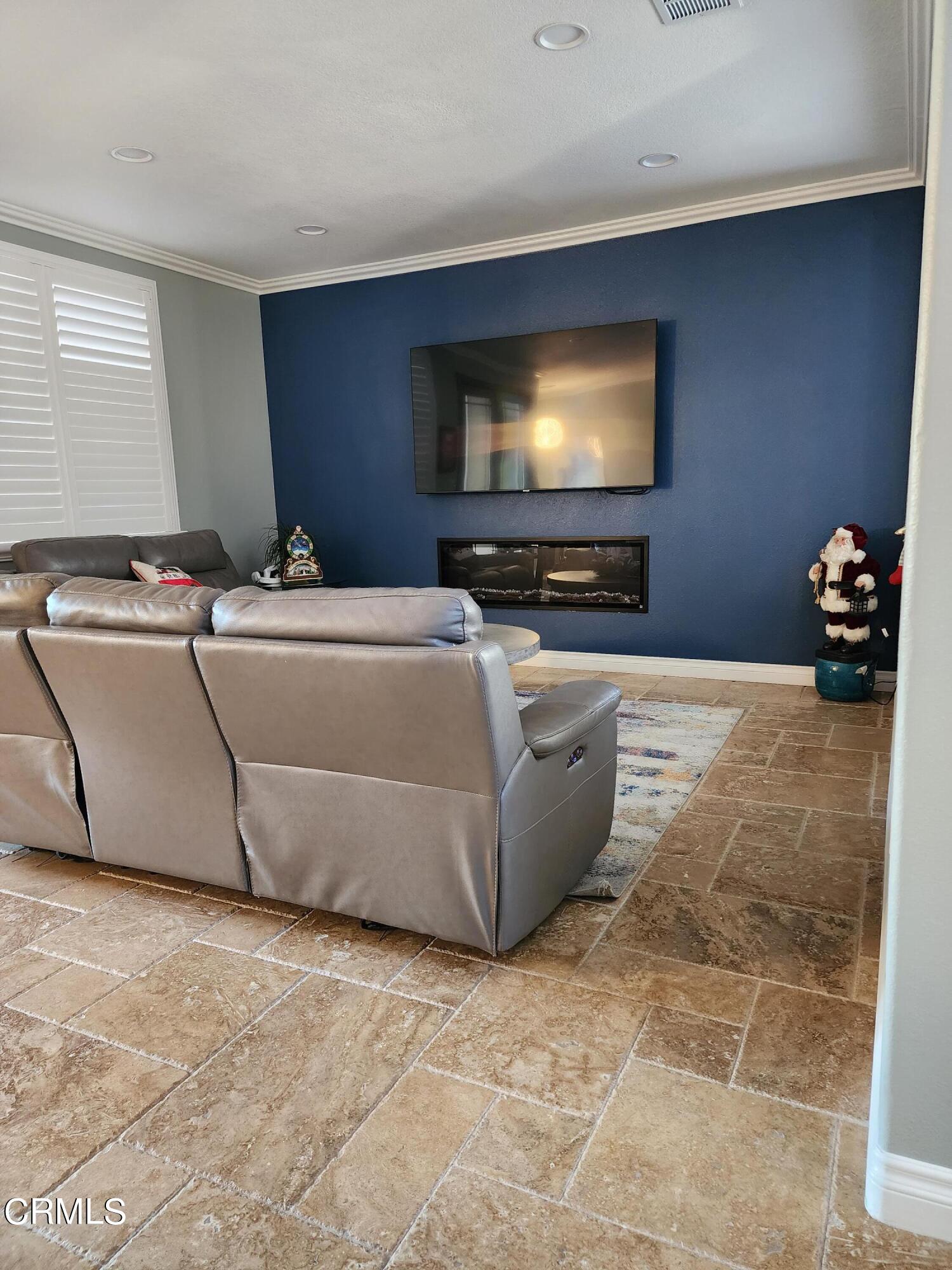 998 Arrasmith Lane Fillmore, CA 93015 - Photo 12 of 40 a living room with furniture and a flat screen tv