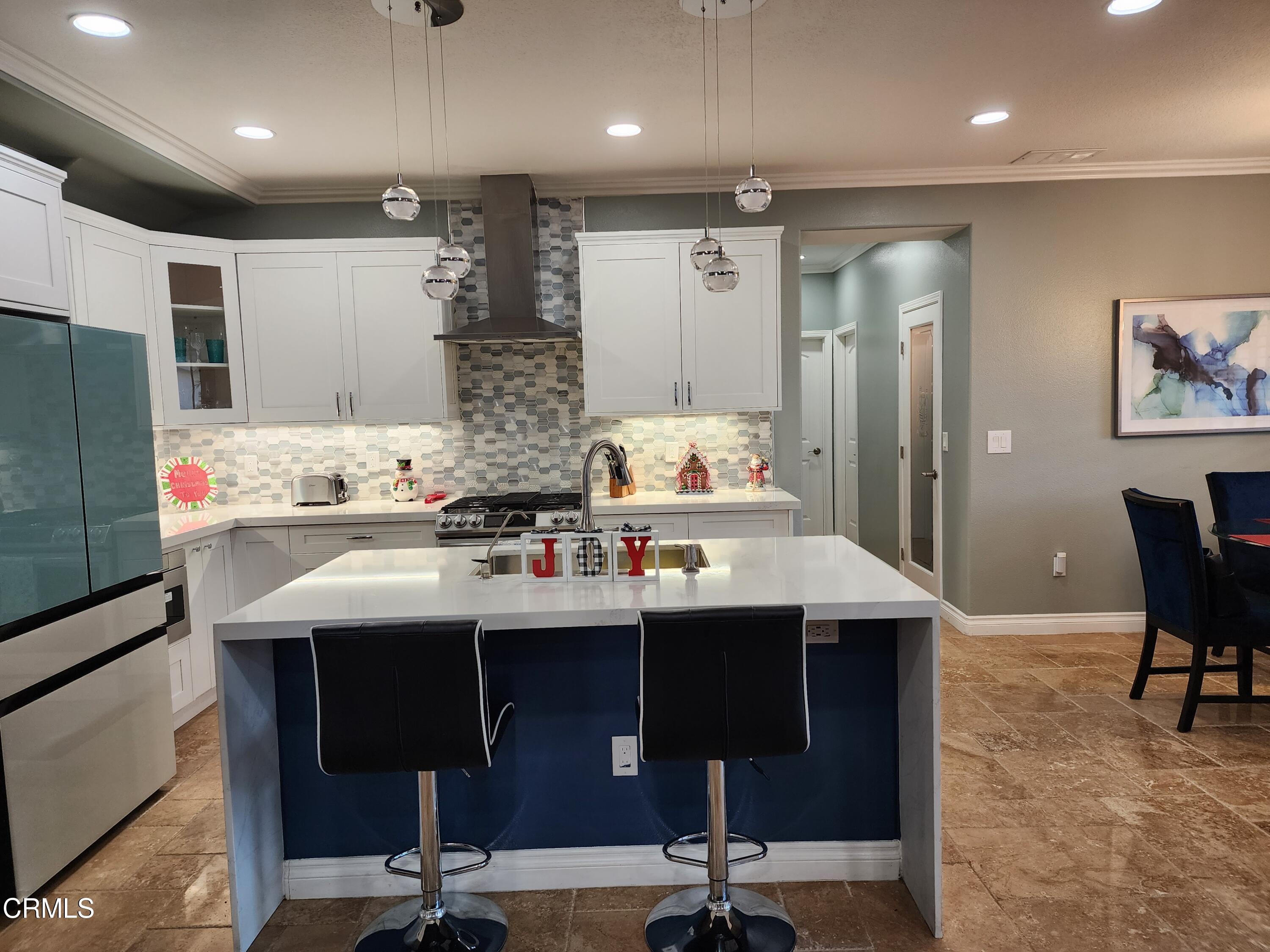 998 Arrasmith Lane Fillmore, CA 93015 - Photo 13 of 40 a kitchen with a sink refrigerator and cabinets