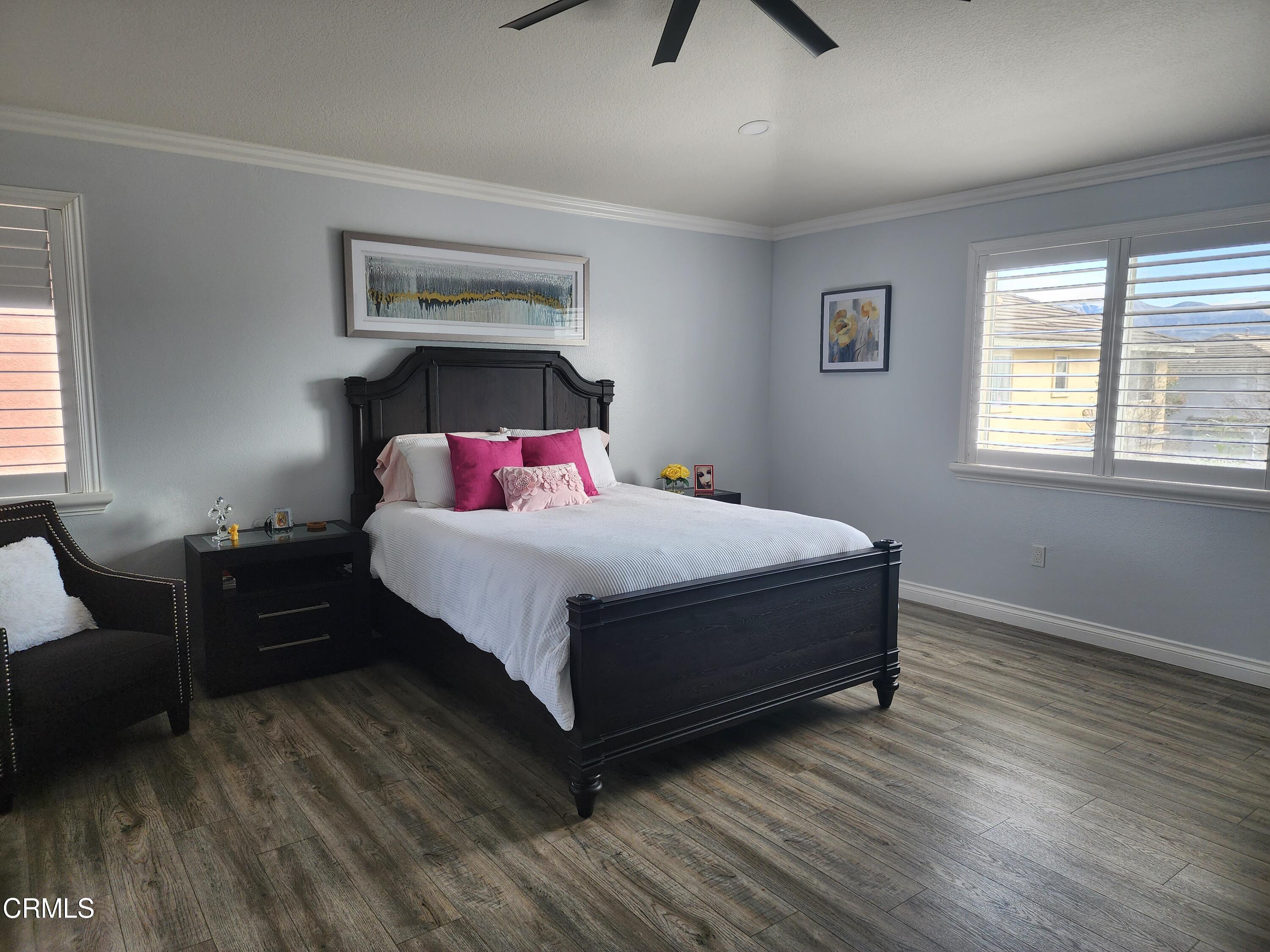 998 Arrasmith Lane Fillmore, CA 93015 - Photo 23 of 40 a bedroom with a bed and wooden floor