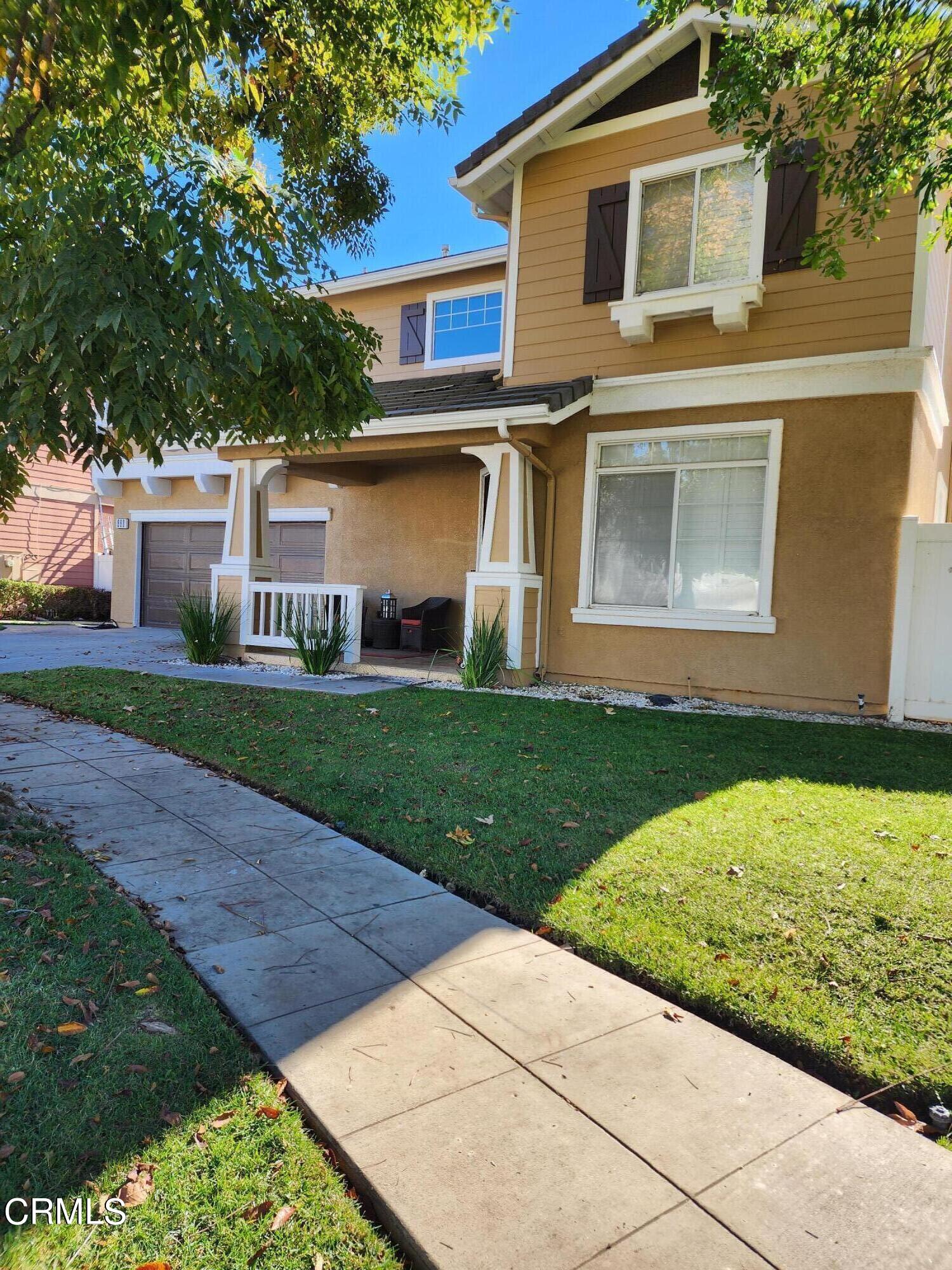 998 Arrasmith Lane Fillmore, CA 93015 - Photo 3 of 40 a front view of a house with a yard and garage