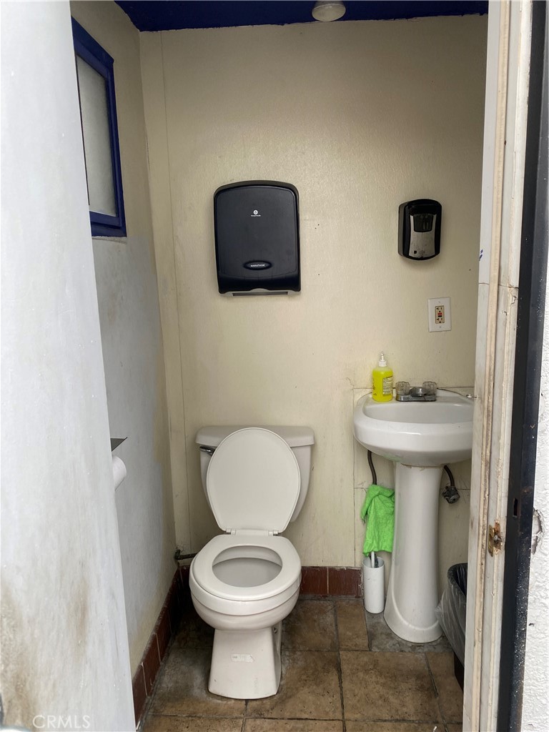 11016 Concert Street El Monte, CA 91731 - Photo 20 of 22 a white toilet sitting next to a bathroom sink