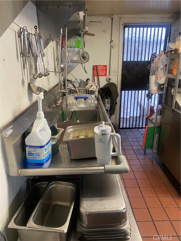 11016 Concert Street El Monte, CA 91731 - Photo 21 of 22 a kitchen with a stove a microwave and cabinets
