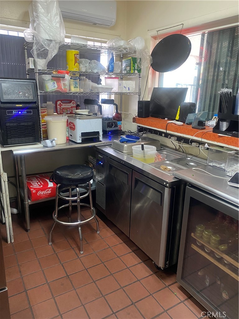 11016 Concert Street El Monte, CA 91731 - Photo 22 of 22 a kitchen with stainless steel appliances granite countertop a sink and a stove