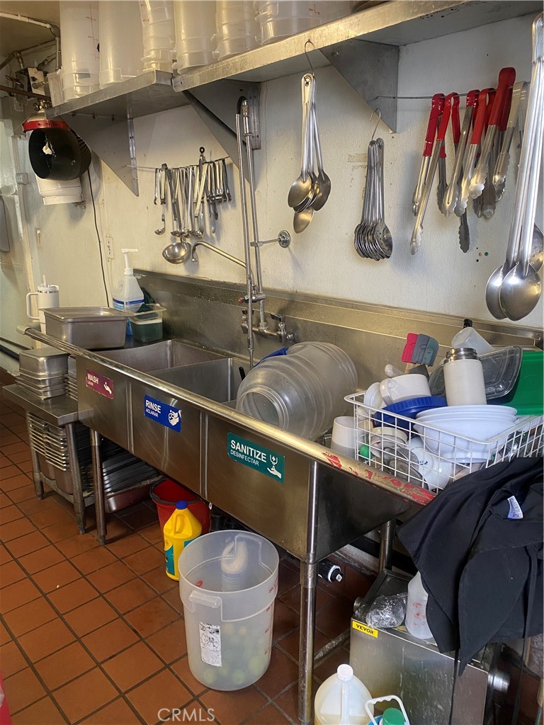 11016 Concert Street El Monte, CA 91731 - Photo 3 of 22 a kitchen with a stove and a table
