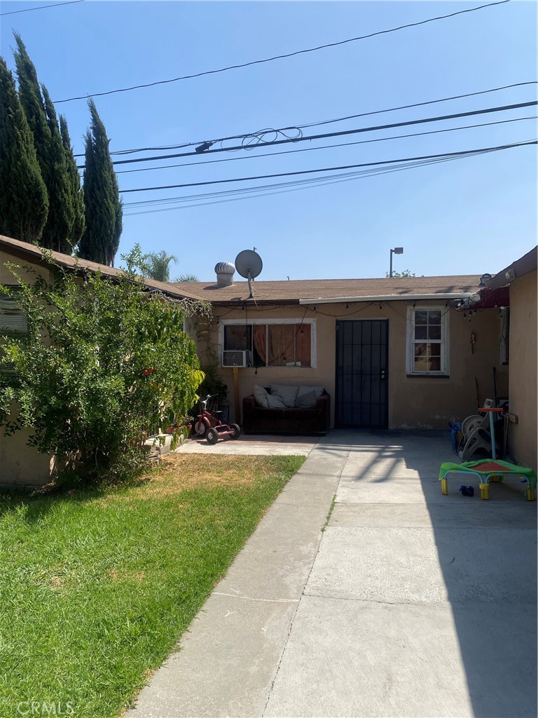 11016 Concert Street El Monte, CA 91731 - Photo 4 of 22 a front view of a house with a garden