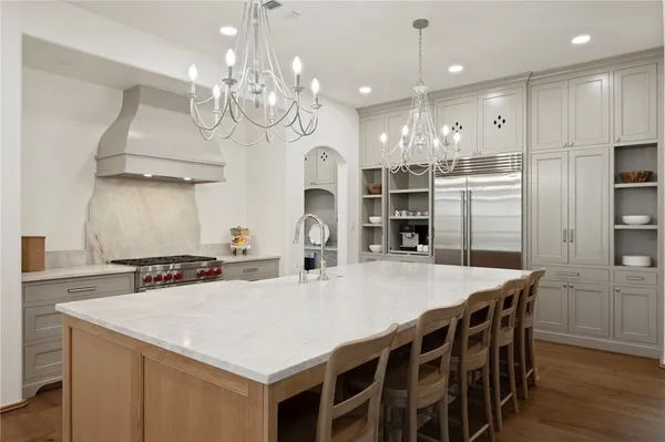 a kitchen that has a table and chairs in it