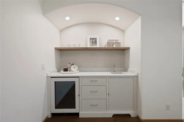 a bathroom with a double vanity sink mirror and shower