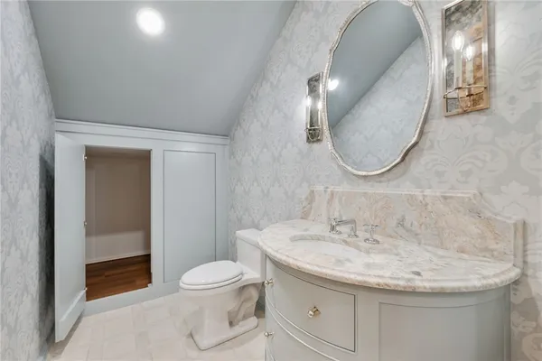 a bathroom with a toilet and a sink