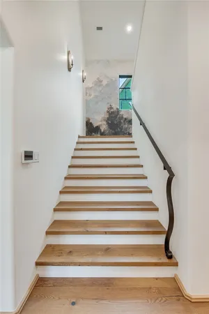 a bathroom with a bathtub and a window