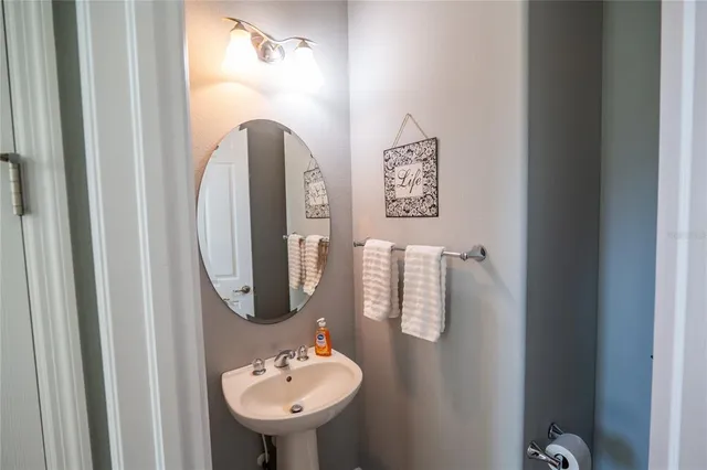 a bathroom with a sink and mirror