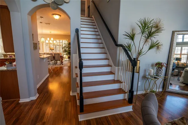 a view of a living room and wooden floor