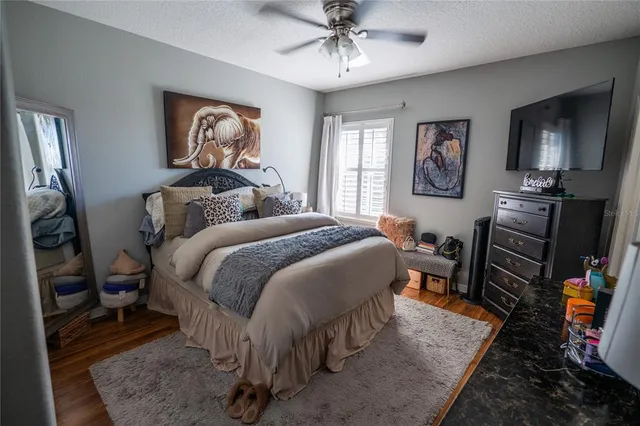 a bedroom with furniture and a window