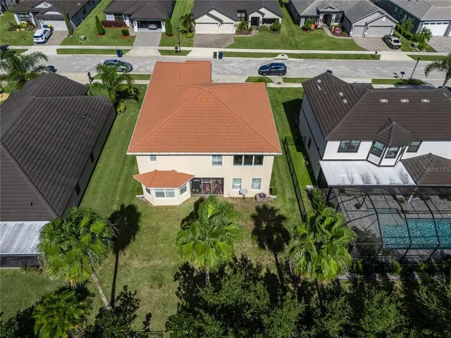 an aerial view of a house with a garden and plants