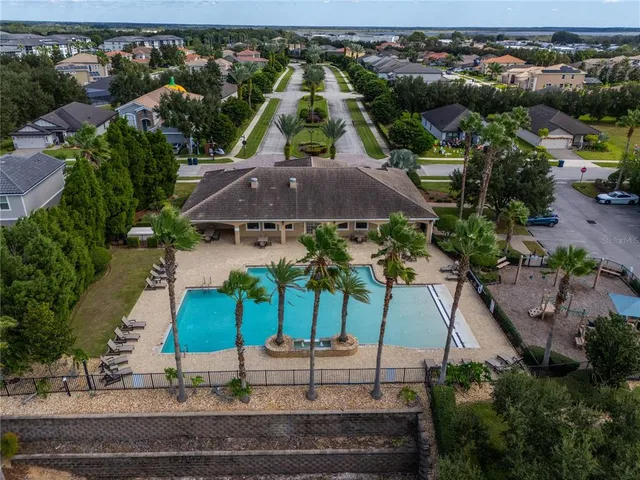 a view of a tennis ground with a big yard