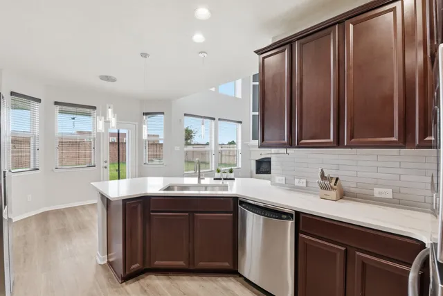 a kitchen with a sink and cabinets