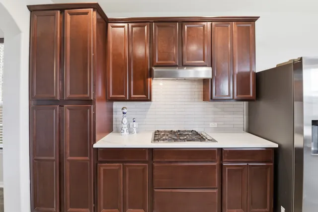 a kitchen with a sink and cabinets