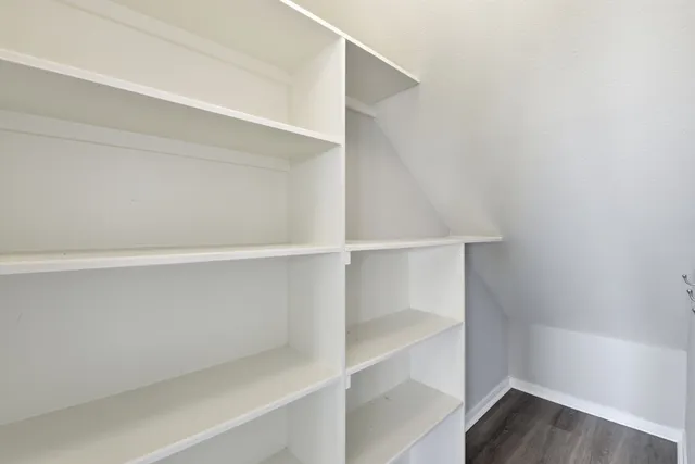 a view of an empty walk in closet