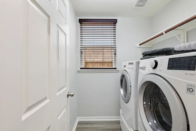 a utility room with dryer and washer
