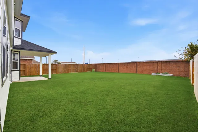 a view of a yard with an outdoor space