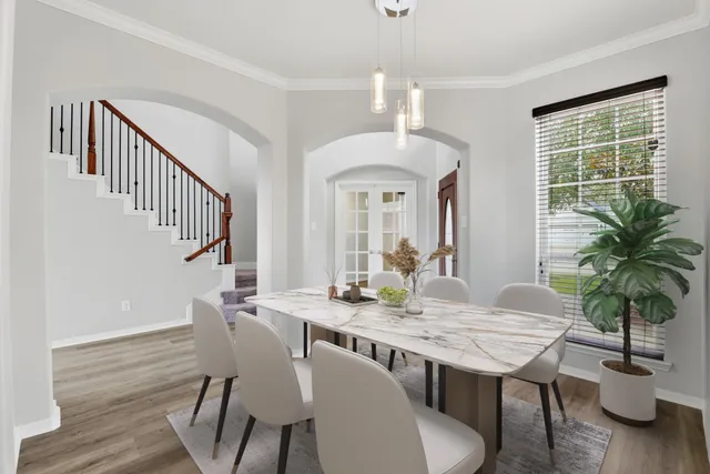 a view of a dining room with furniture window and wooden floor