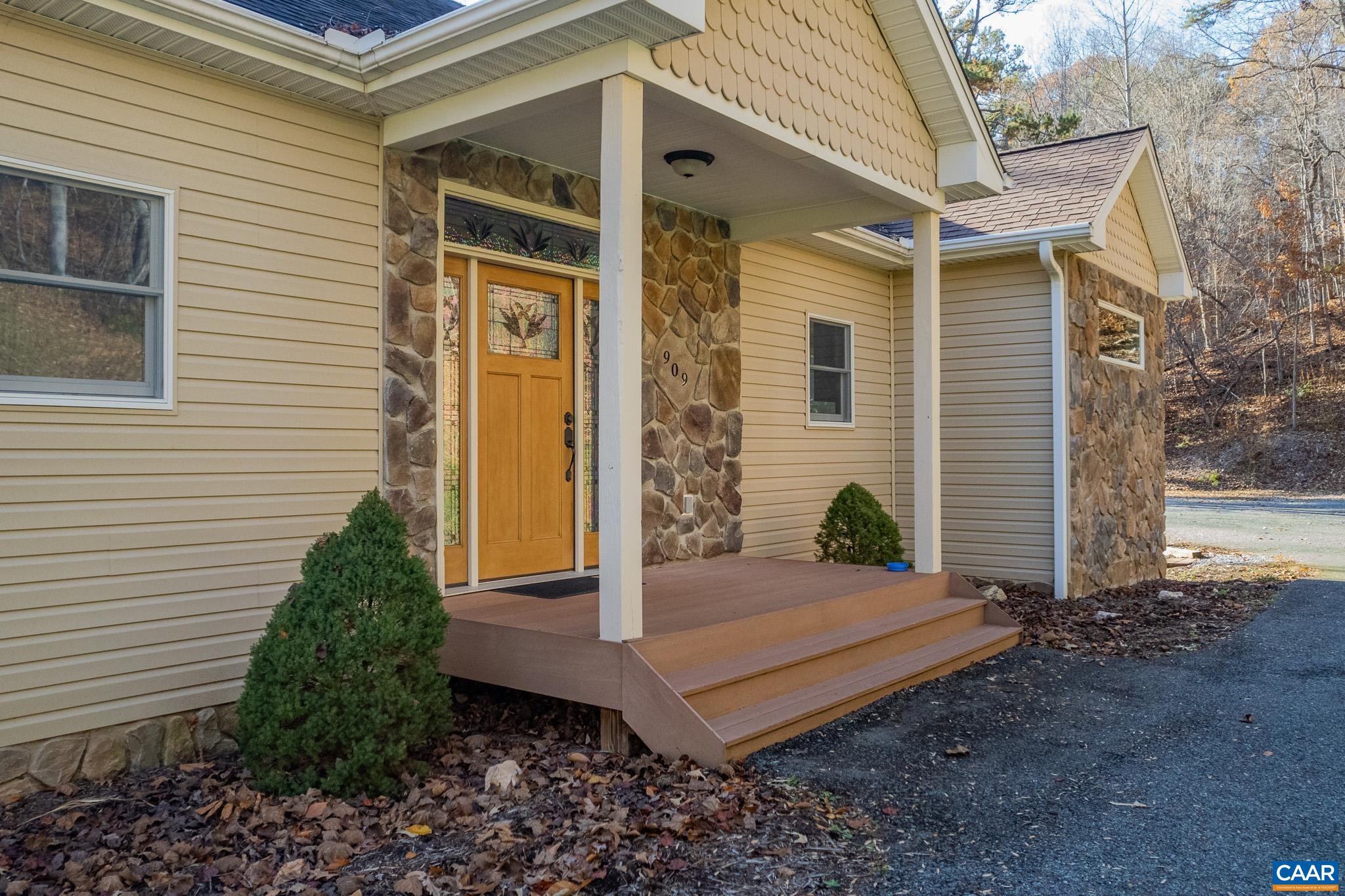 909 Gap Bridge Road Moneta, VA 24121 - Photo 1 of 75 a view of a house with backyard and garden