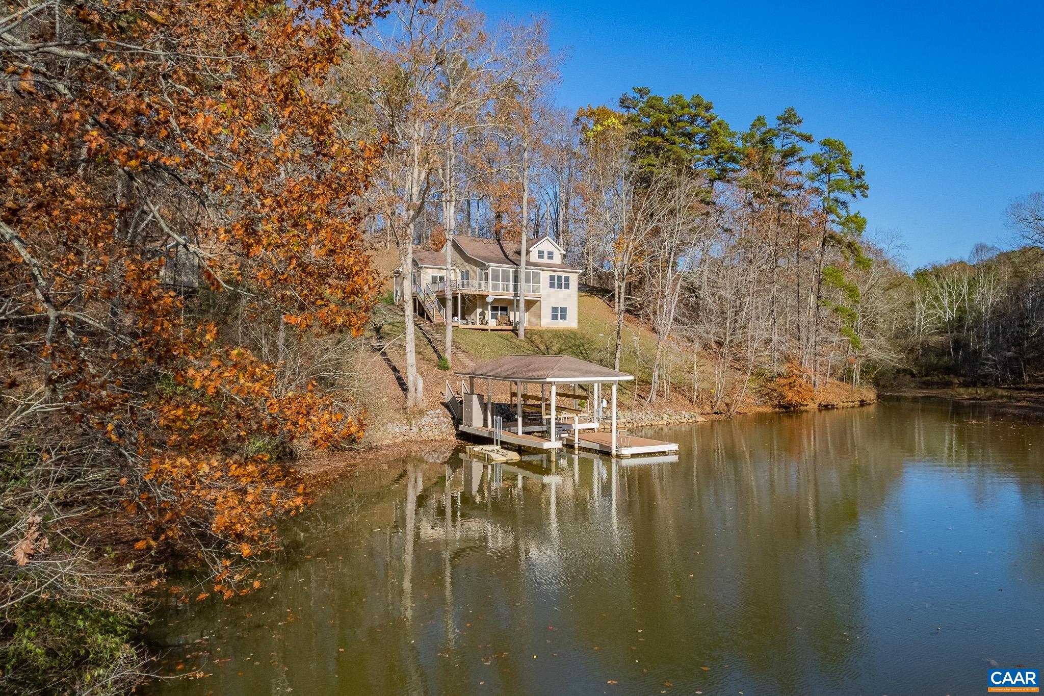 909 Gap Bridge Road Moneta, VA 24121 - Photo 11 of 75 a view of house with outdoor space and lake view