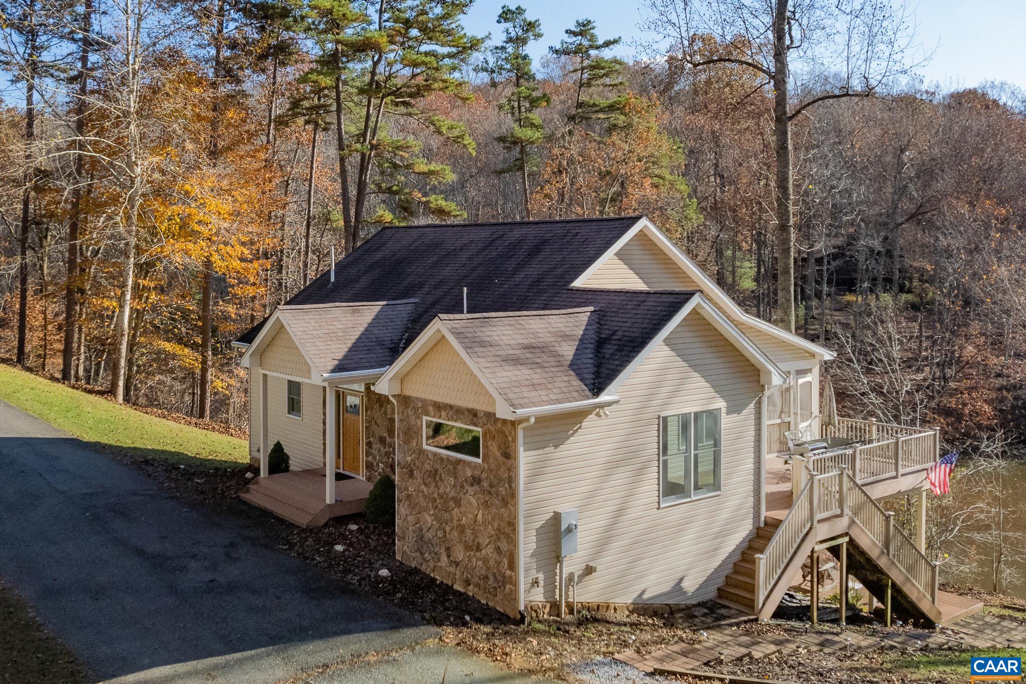 909 Gap Bridge Road Moneta, VA 24121 - Photo 12 of 75 a front view of a house with a yard