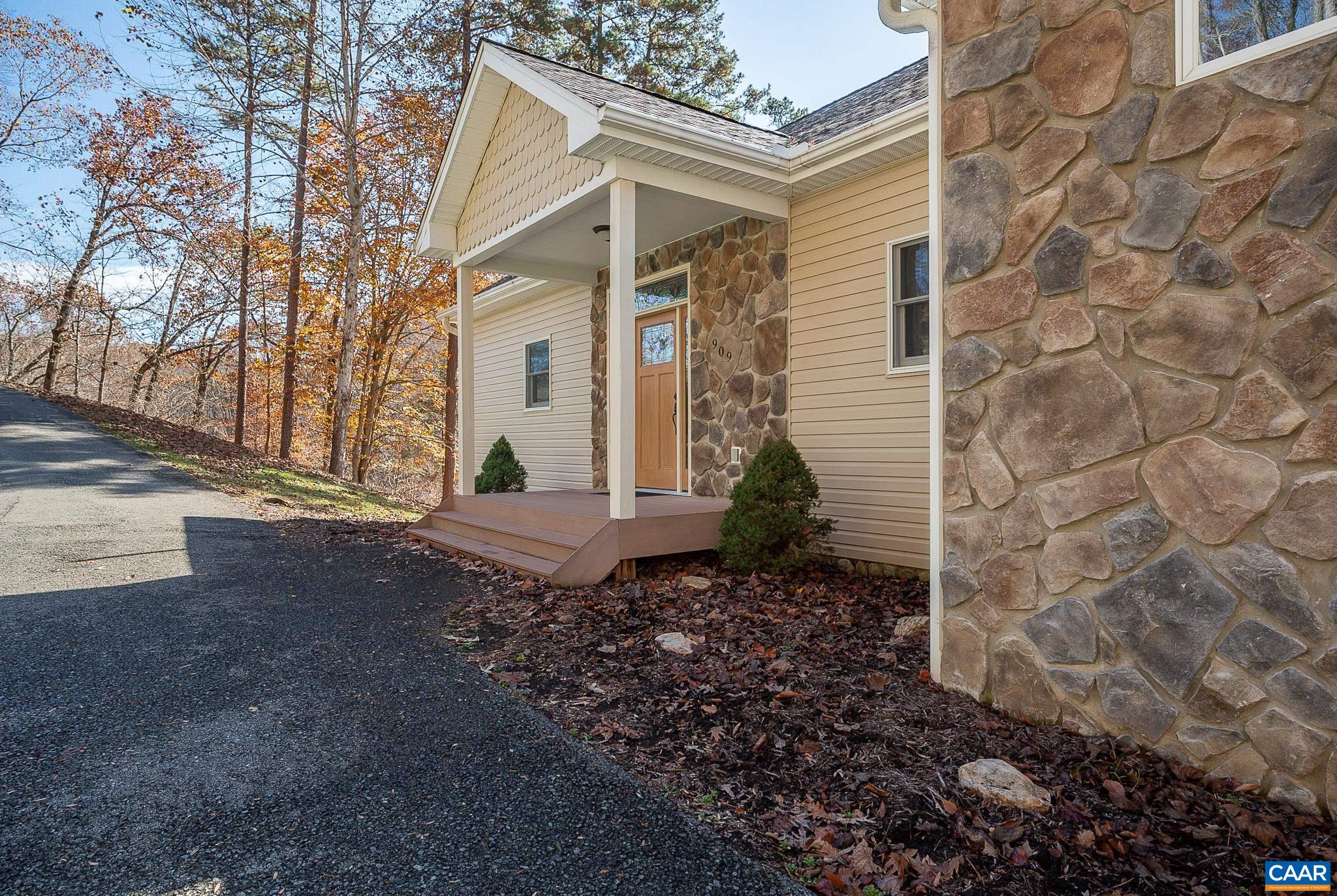 909 Gap Bridge Road Moneta, VA 24121 - Photo 20 of 75 a view of a house with a yard