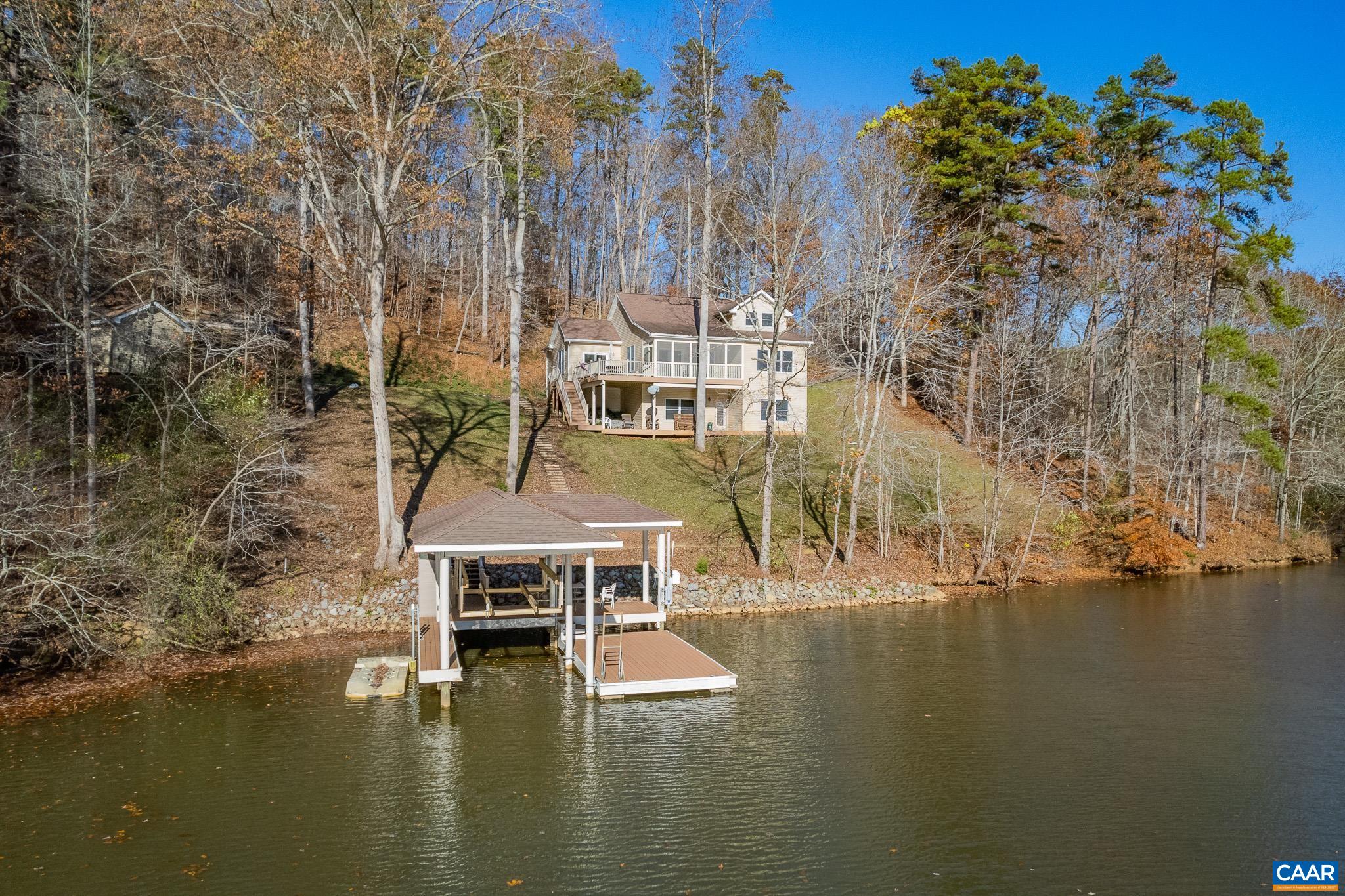 909 Gap Bridge Road Moneta, VA 24121 - Photo 2 of 75 a view of a lake with boats and trees in the background