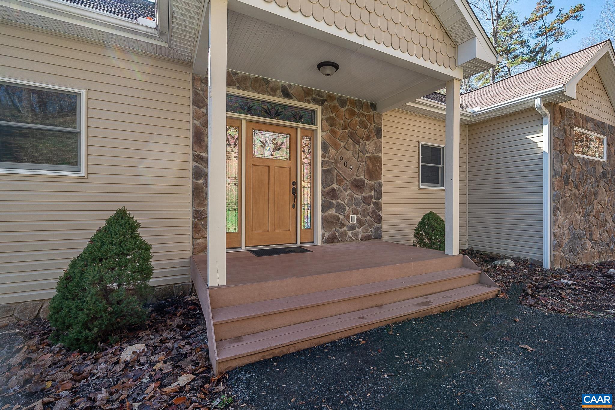 909 Gap Bridge Road Moneta, VA 24121 - Photo 21 of 75 a view of backyard with plants and outdoor seating