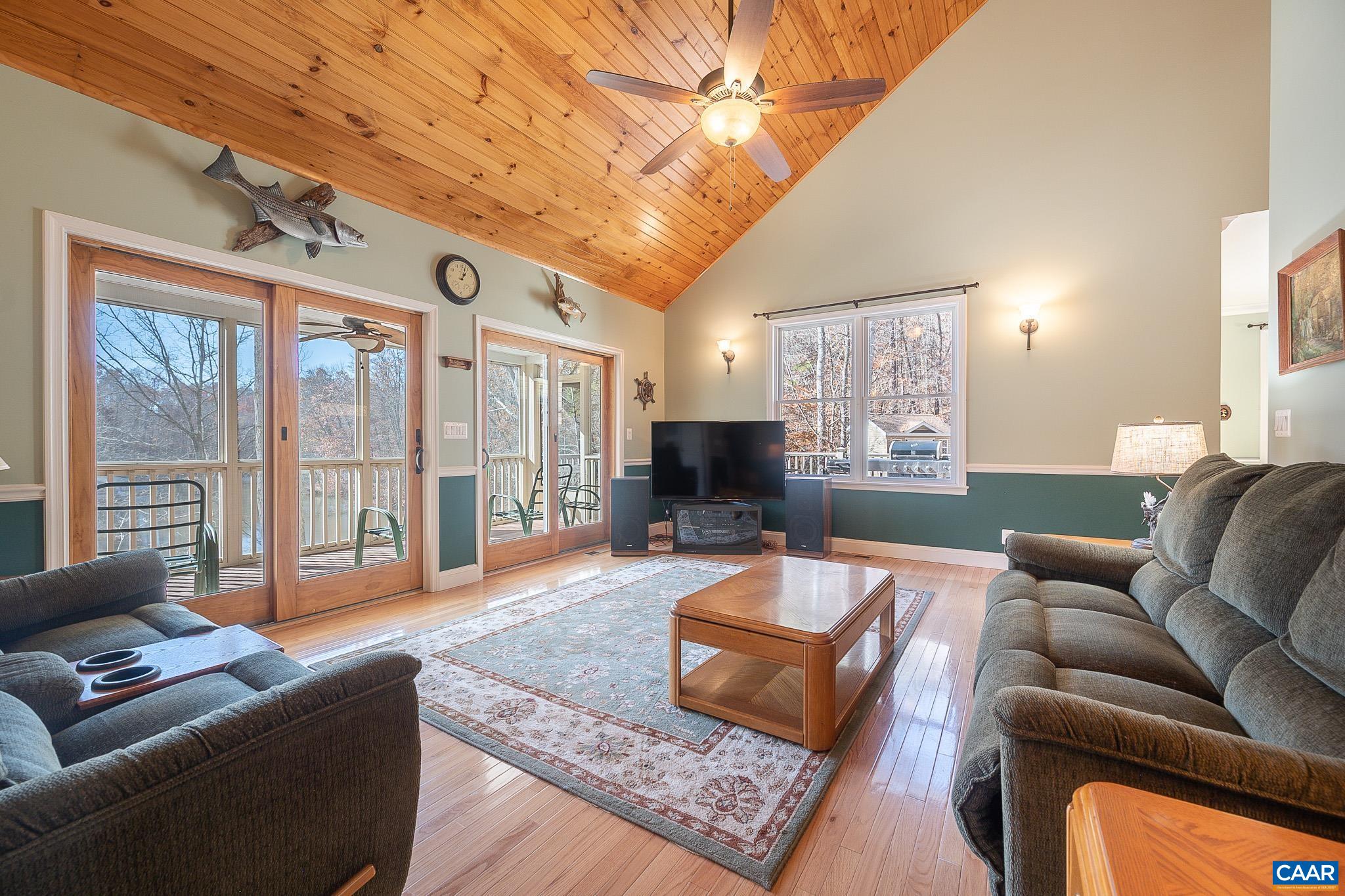 909 Gap Bridge Road Moneta, VA 24121 - Photo 26 of 75 a living room with furniture or outdoor view and a large window