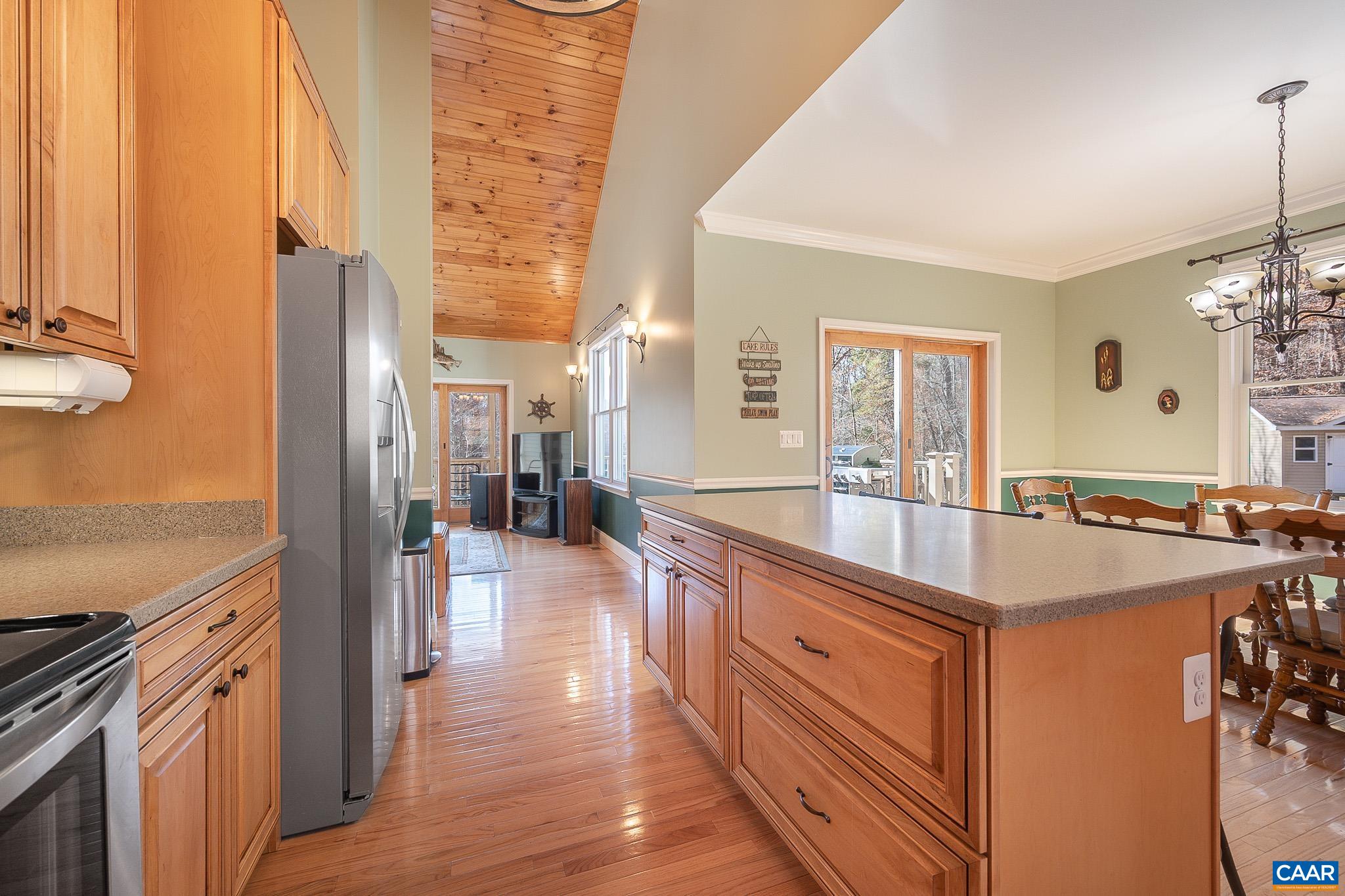 909 Gap Bridge Road Moneta, VA 24121 - Photo 37 of 75 a kitchen with stainless steel appliances granite countertop a sink and a stove top oven