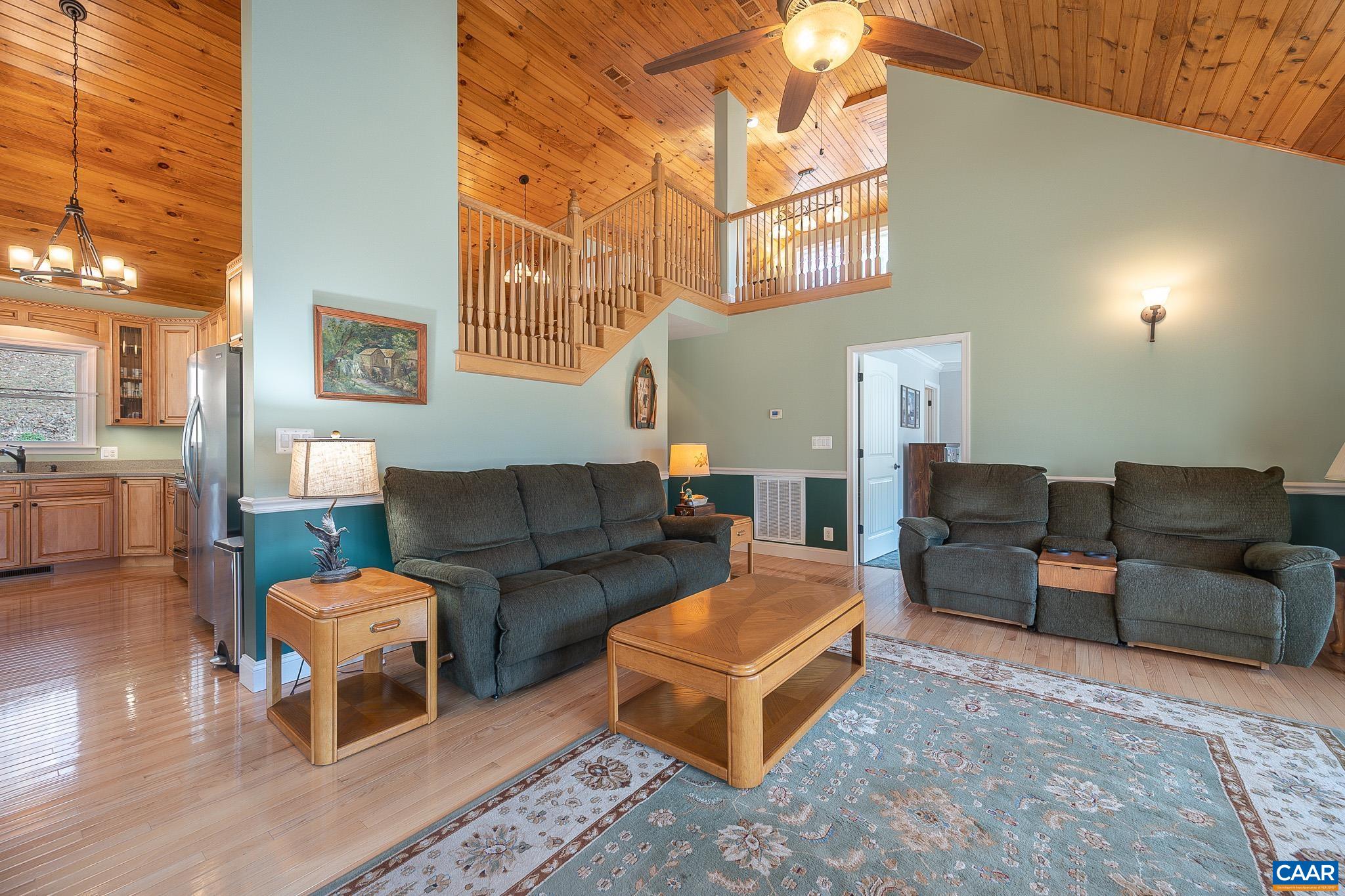 909 Gap Bridge Road Moneta, VA 24121 - Photo 38 of 75 a living room with furniture and a fireplace